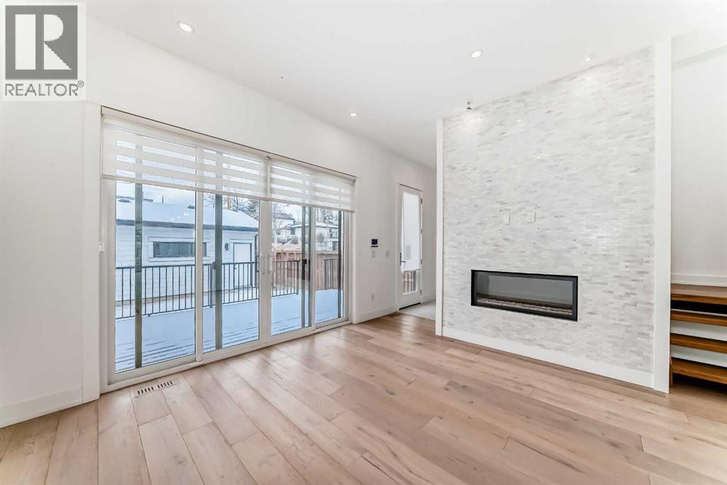 923 36A Street Nw, Calgary, AB - Indoor With Fireplace
