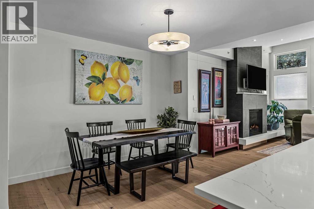 283C Three Sisters Drive, Canmore, AB - Indoor Photo Showing Dining Room With Fireplace