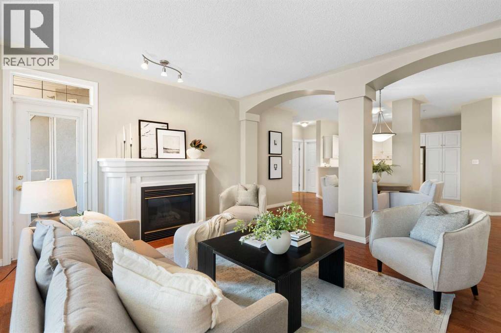 404, 2422 Erlton Street Sw, Calgary, AB - Indoor Photo Showing Living Room With Fireplace