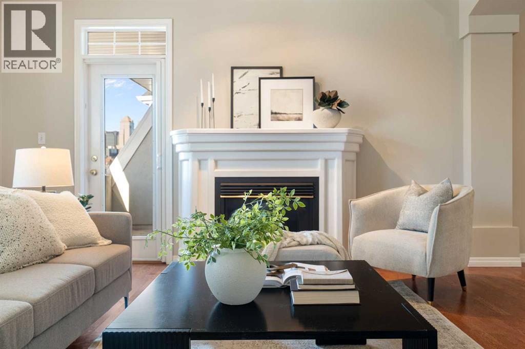 404, 2422 Erlton Street Sw, Calgary, AB - Indoor Photo Showing Living Room With Fireplace