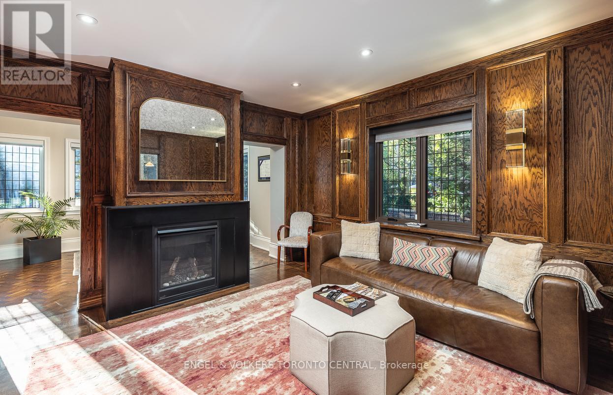 Custom wood panelling w/ fireplace - 1 Bryce Avenue, Toronto, ON - Indoor Photo Showing Living Room With Fireplace