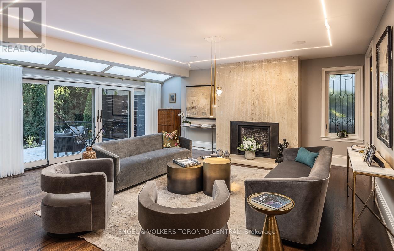 Sun-filled living room with gas fireplace - 1 Bryce Avenue, Toronto, ON - Indoor Photo Showing Living Room With Fireplace