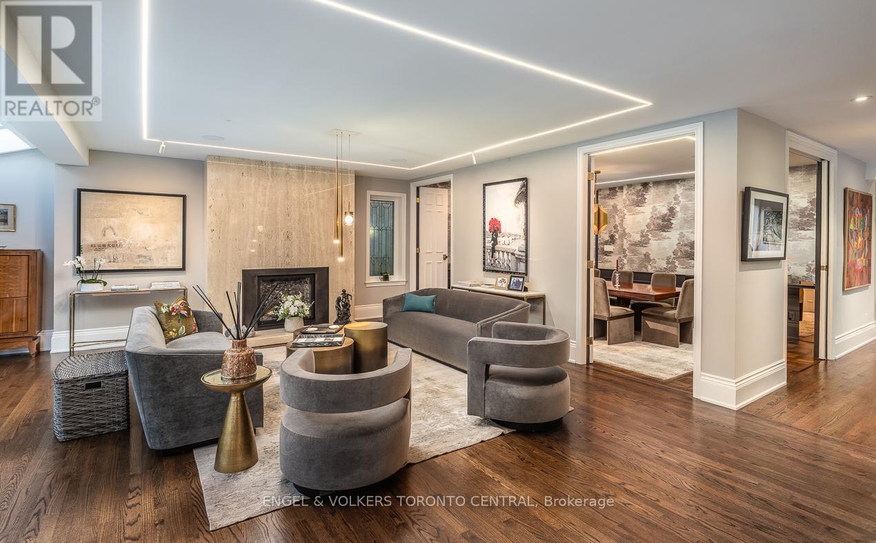 Inlay strip lighting and designer fixtures - 1 Bryce Avenue, Toronto, ON - Indoor Photo Showing Living Room With Fireplace