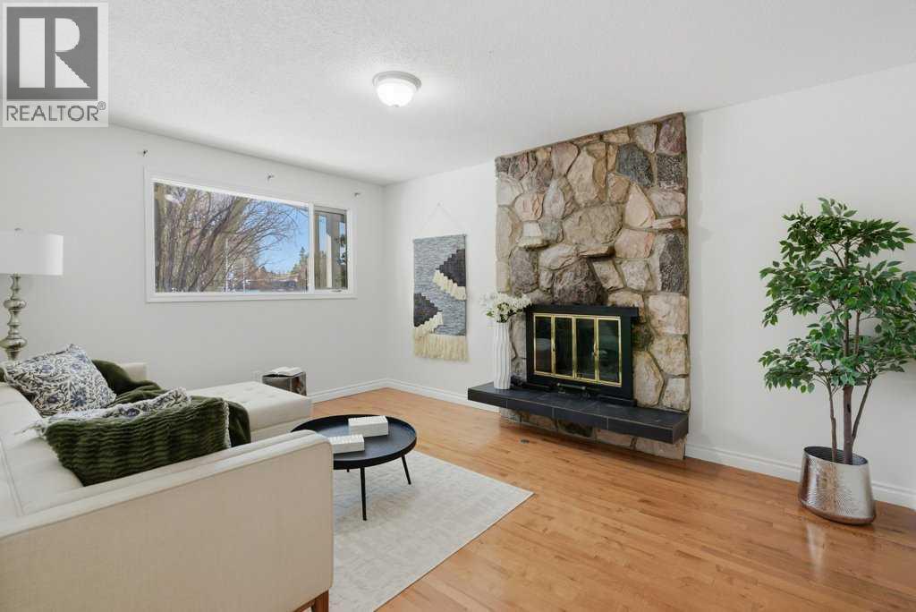 3703 Valdes Place Nw, Calgary, AB - Indoor Photo Showing Living Room With Fireplace