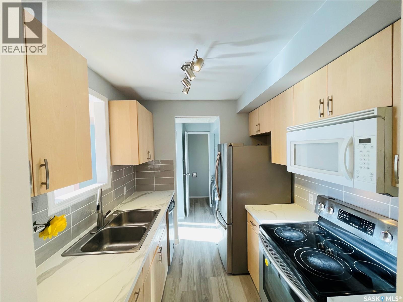 5026 10Th Avenue, Regina, SK - Indoor Photo Showing Kitchen With Stainless Steel Kitchen With Double Sink