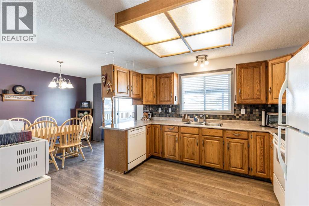 52 Ross Haven Way Se, Medicine Hat, AB - Indoor Photo Showing Kitchen With Double Sink
