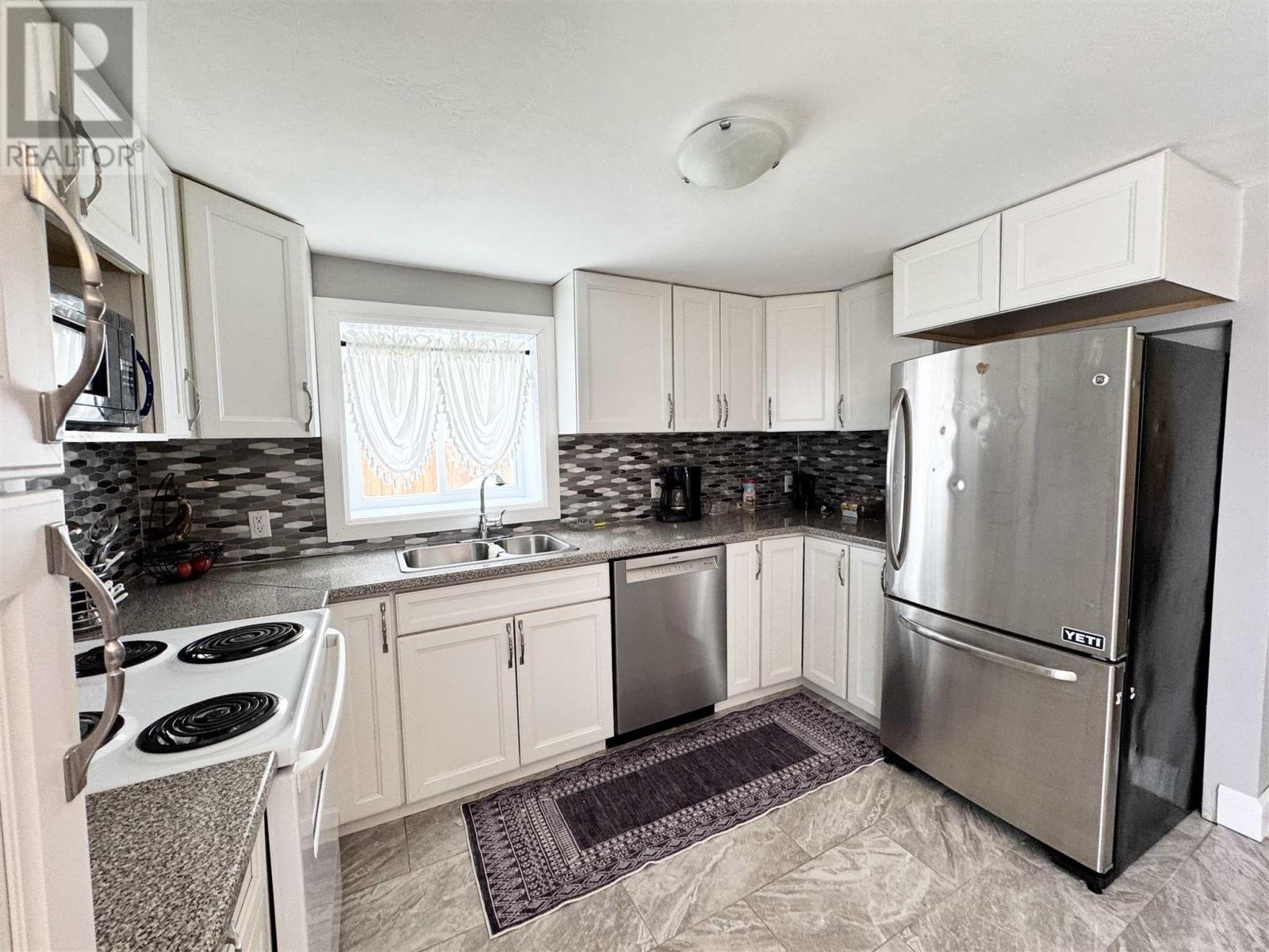 73 Lansdowne St S, Chapleau, ON - Indoor Photo Showing Kitchen With Double Sink