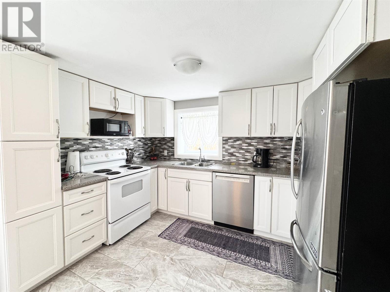 73 Lansdowne St S, Chapleau, ON - Indoor Photo Showing Kitchen With Double Sink