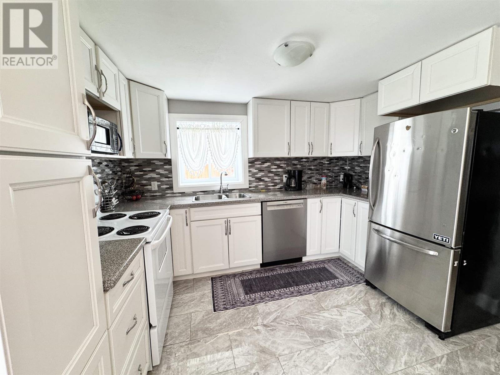 73 Lansdowne St S, Chapleau, ON - Indoor Photo Showing Kitchen With Double Sink