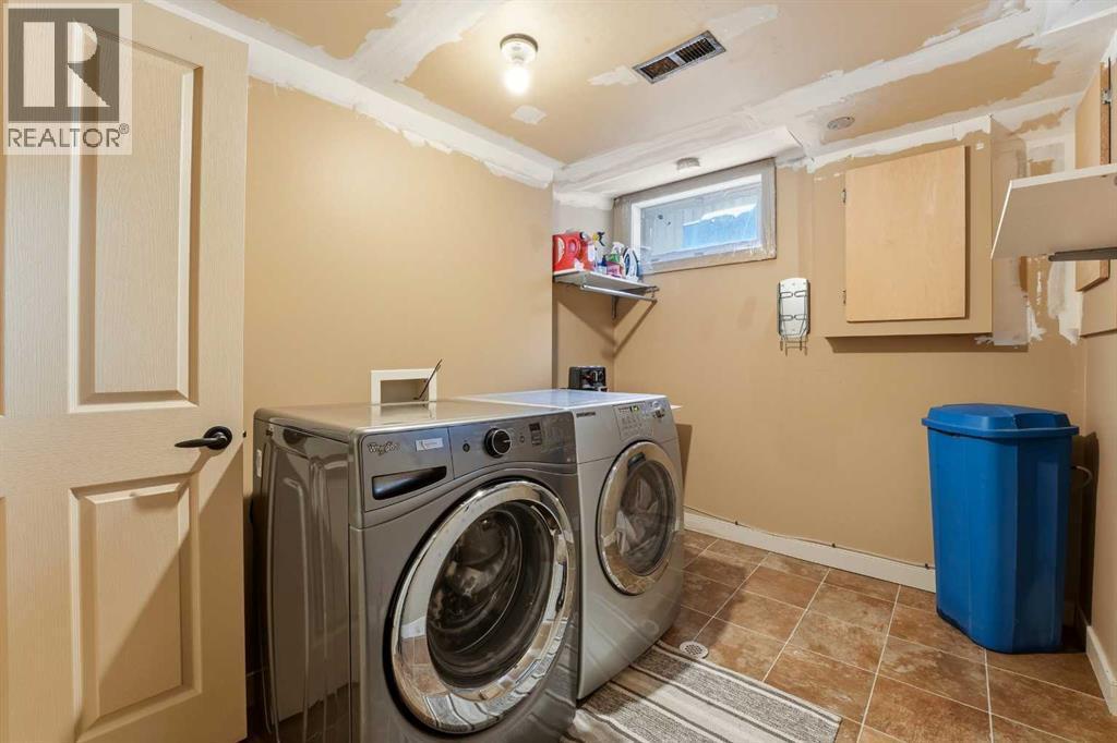 Shared Laundry - 14 Sherwood Crescent, Red Deer, AB - Indoor Photo Showing Laundry Room