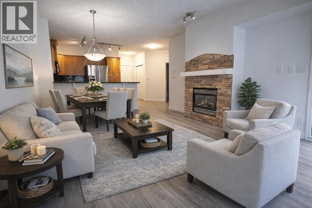 201, 10 Discovery Ridge Close Sw, Calgary, AB - Indoor Photo Showing Living Room With Fireplace