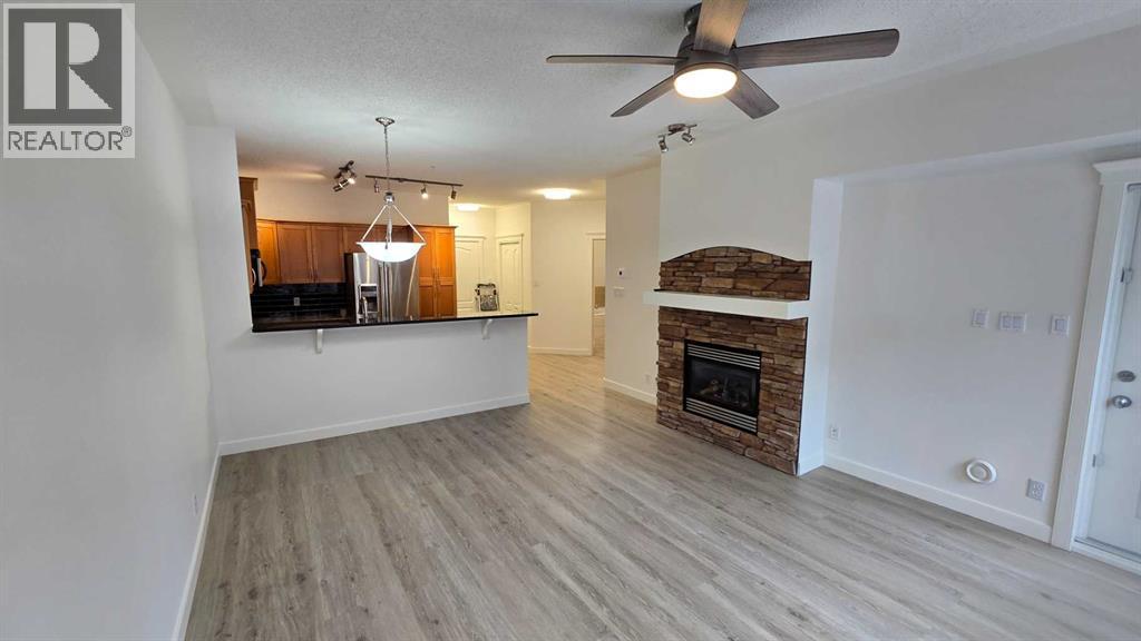 201, 10 Discovery Ridge Close Sw, Calgary, AB - Indoor With Fireplace