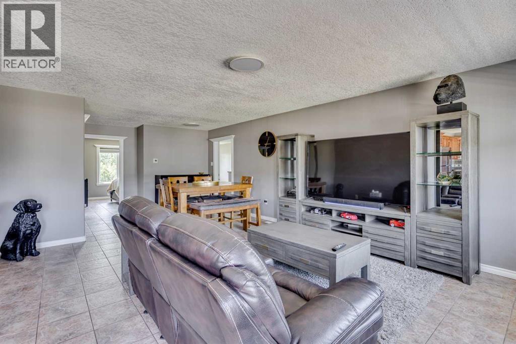 117 Cheecham Court, Anzac, AB - Indoor Photo Showing Living Room