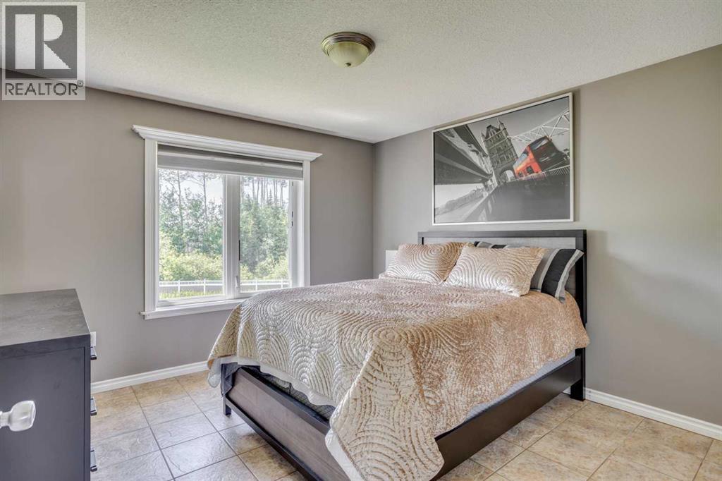 117 Cheecham Court, Anzac, AB - Indoor Photo Showing Bedroom