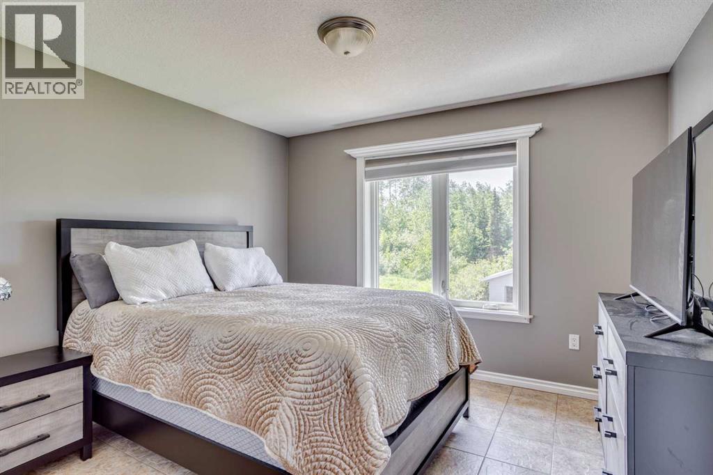 117 Cheecham Court, Anzac, AB - Indoor Photo Showing Bedroom