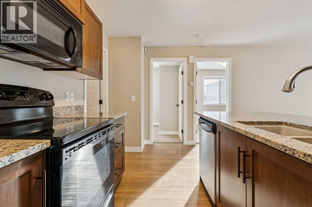 4102, 2781 Chinook Winds Drive Sw, Airdrie, AB - Indoor Photo Showing Kitchen With Double Sink With Upgraded Kitchen