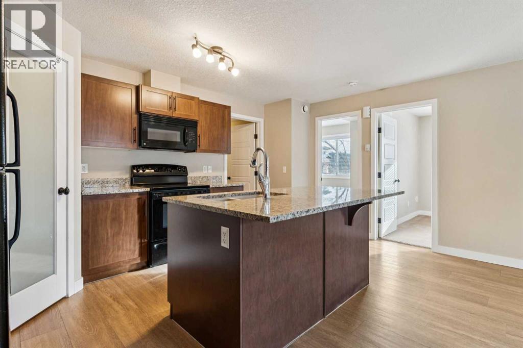 4102, 2781 Chinook Winds Drive Sw, Airdrie, AB - Indoor Photo Showing Kitchen With Double Sink
