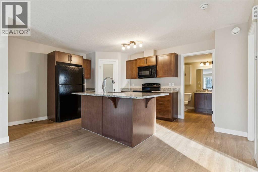 4102, 2781 Chinook Winds Drive Sw, Airdrie, AB - Indoor Photo Showing Kitchen