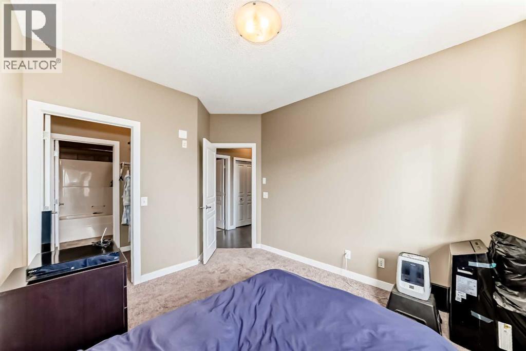 312, 48 Panatella Road Nw, Calgary, AB - Indoor Photo Showing Bedroom