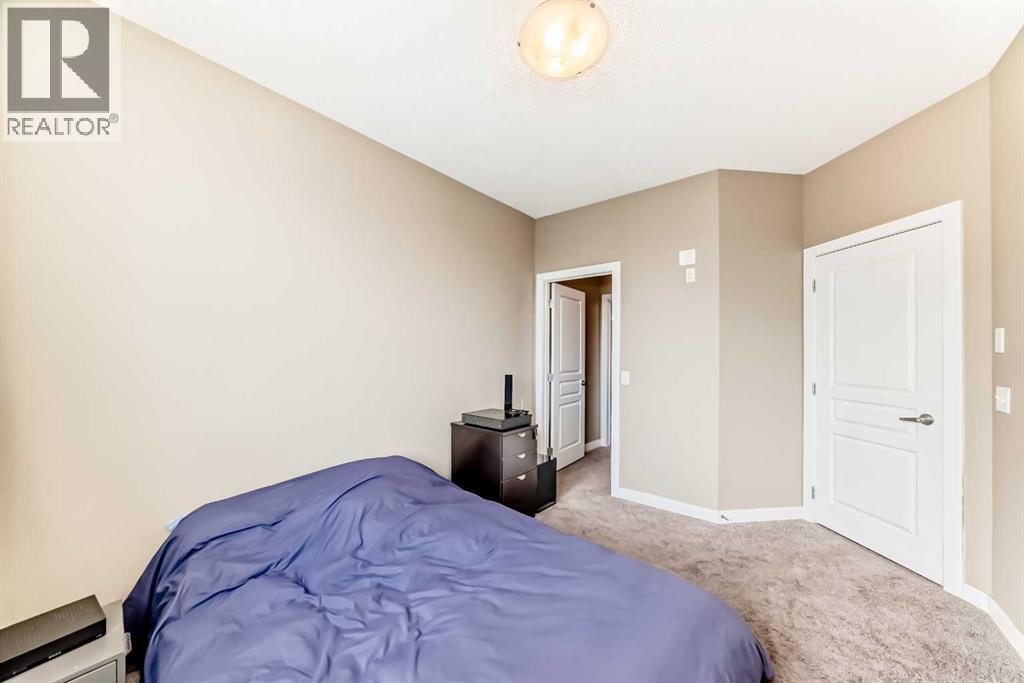312, 48 Panatella Road Nw, Calgary, AB - Indoor Photo Showing Bedroom