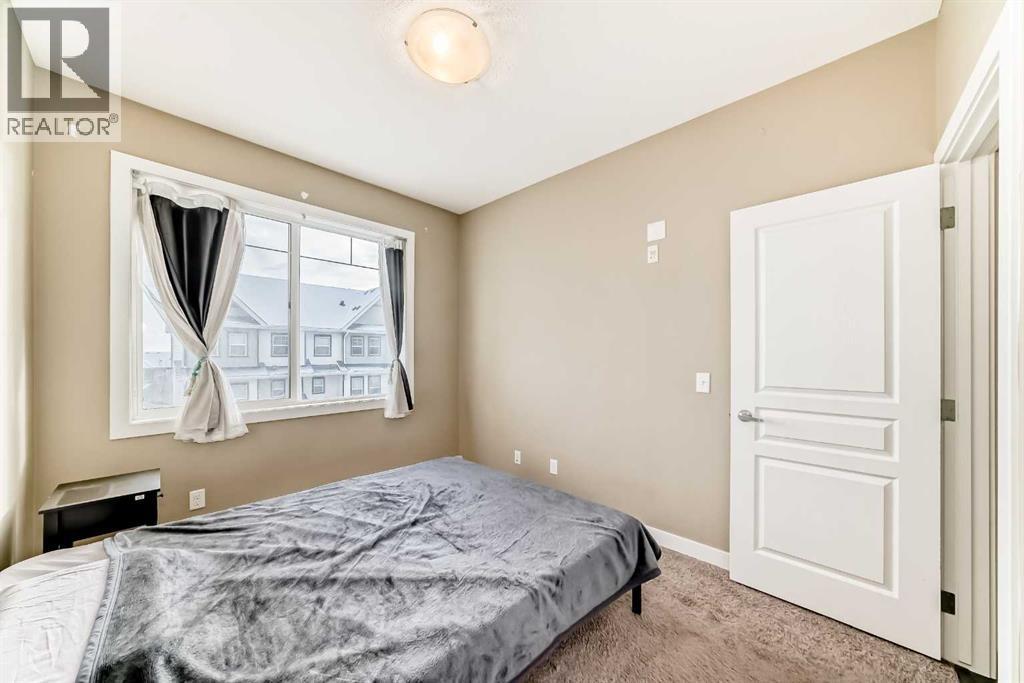 312, 48 Panatella Road Nw, Calgary, AB - Indoor Photo Showing Bedroom