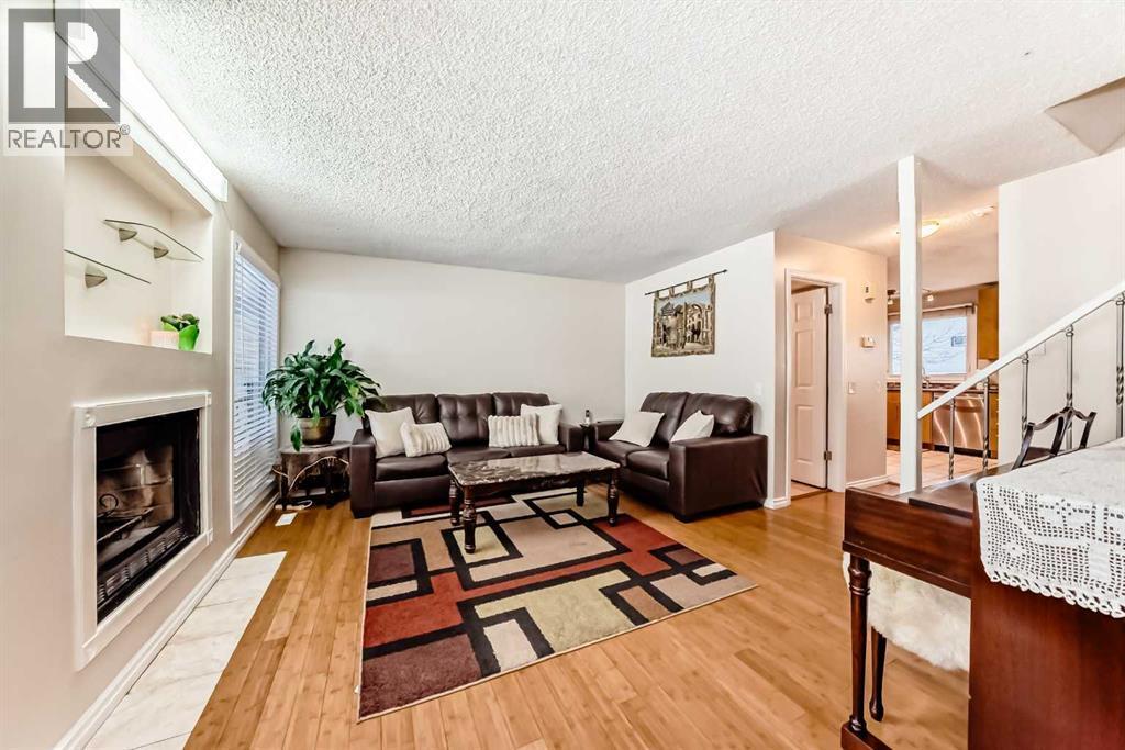 562 Strathcona Drive Sw, Calgary, AB - Indoor Photo Showing Living Room With Fireplace