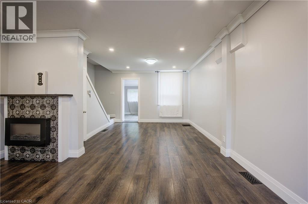 303 Hunter Street W, Hamilton, ON - Indoor Photo Showing Other Room With Fireplace