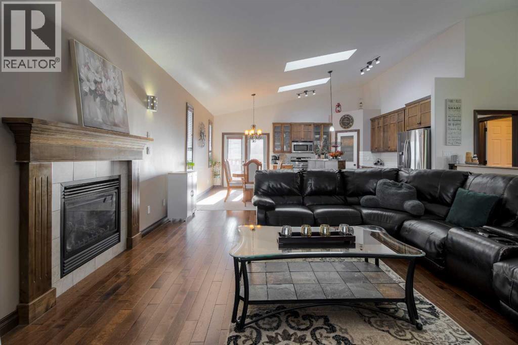 380 Grizzly Crescent N, Lethbridge, AB - Indoor Photo Showing Living Room With Fireplace