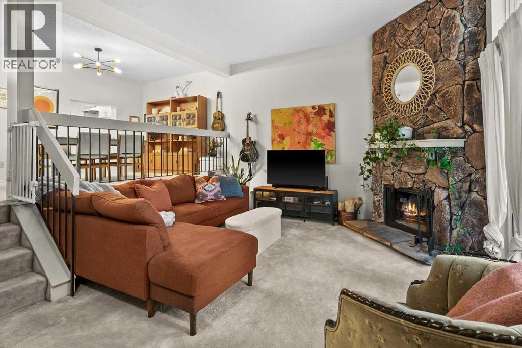 505, 3131 63 Avenue Sw, Calgary, AB - Indoor Photo Showing Living Room With Fireplace