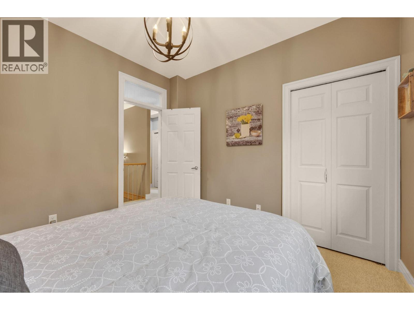 Second bedroom on the main floor - 867 Steele Road, Kelowna, BC - Indoor Photo Showing Bedroom