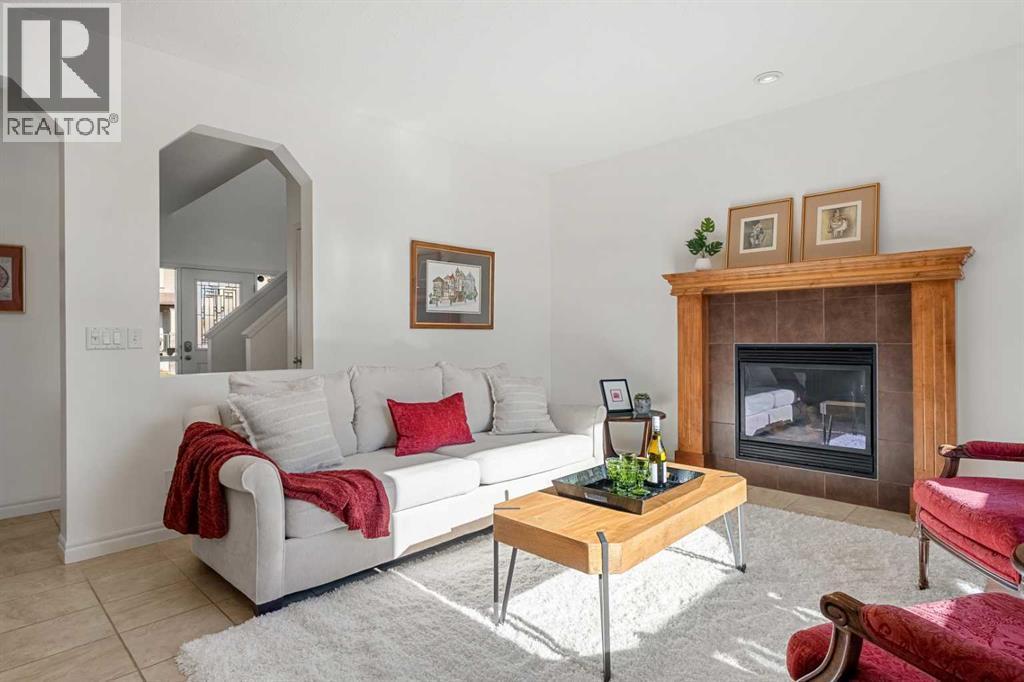 345 Prestwick Terrace Se, Calgary, AB - Indoor Photo Showing Living Room With Fireplace
