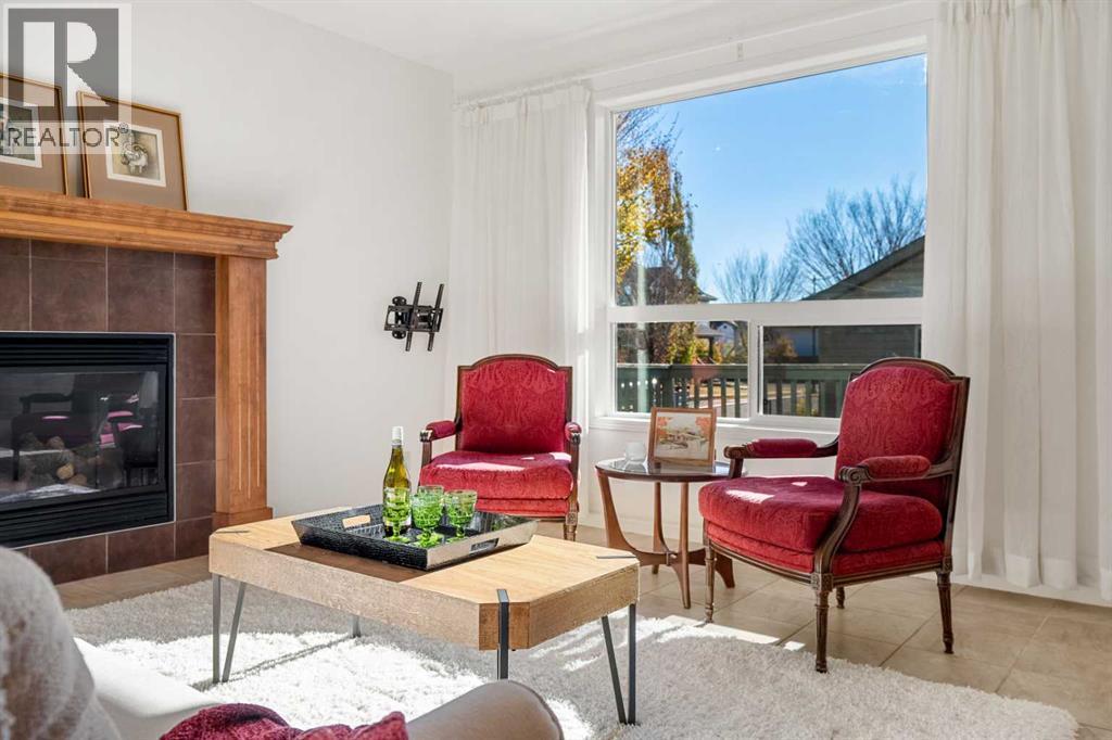 345 Prestwick Terrace Se, Calgary, AB - Indoor Photo Showing Living Room With Fireplace
