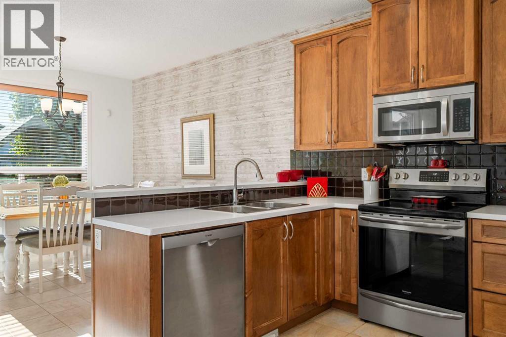 345 Prestwick Terrace Se, Calgary, AB - Indoor Photo Showing Kitchen With Double Sink