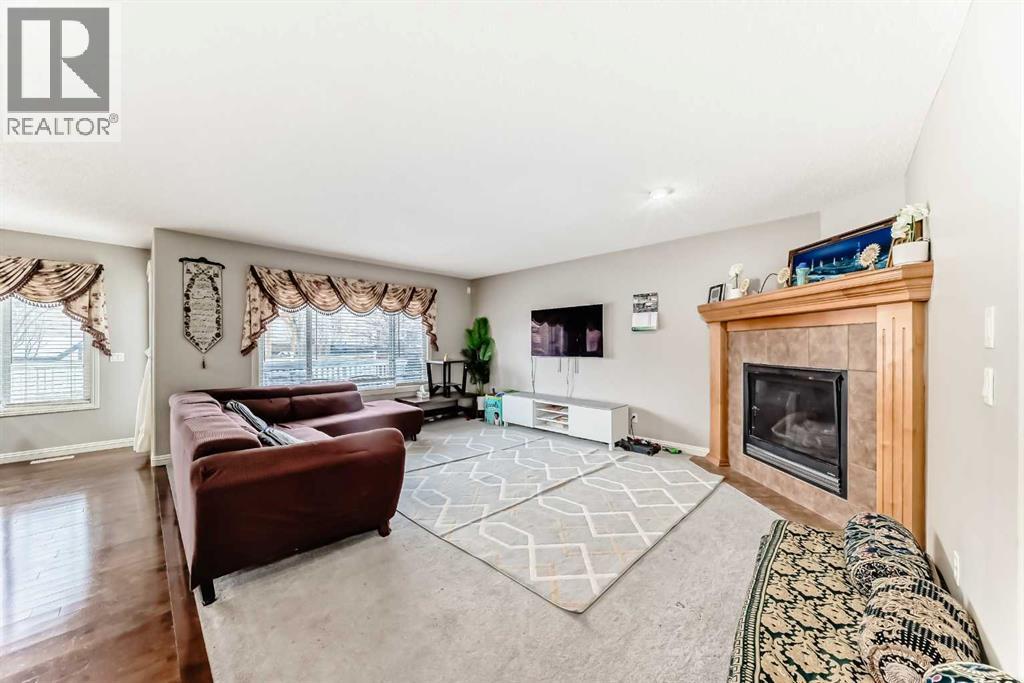 2468 Kingsland View Se, Airdrie, AB - Indoor Photo Showing Living Room With Fireplace