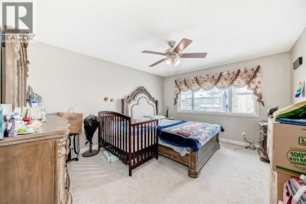 2468 Kingsland View Se, Airdrie, AB - Indoor Photo Showing Bedroom