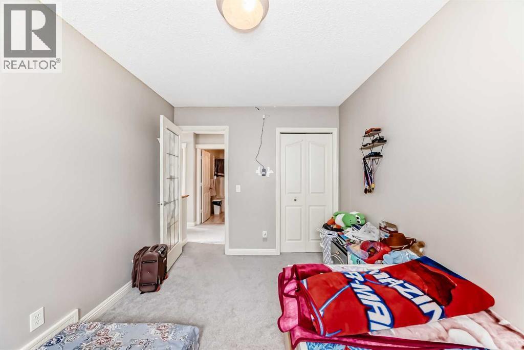 2468 Kingsland View Se, Airdrie, AB - Indoor Photo Showing Bedroom