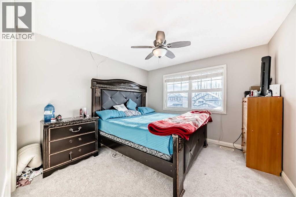 2468 Kingsland View Se, Airdrie, AB - Indoor Photo Showing Bedroom