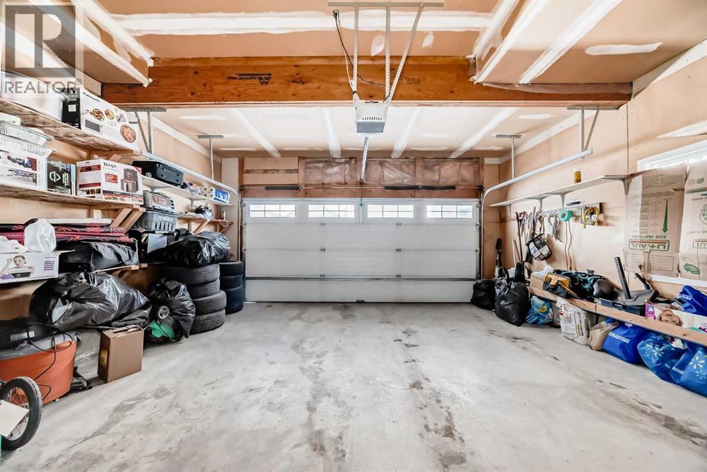 2468 Kingsland View Se, Airdrie, AB - Indoor Photo Showing Garage