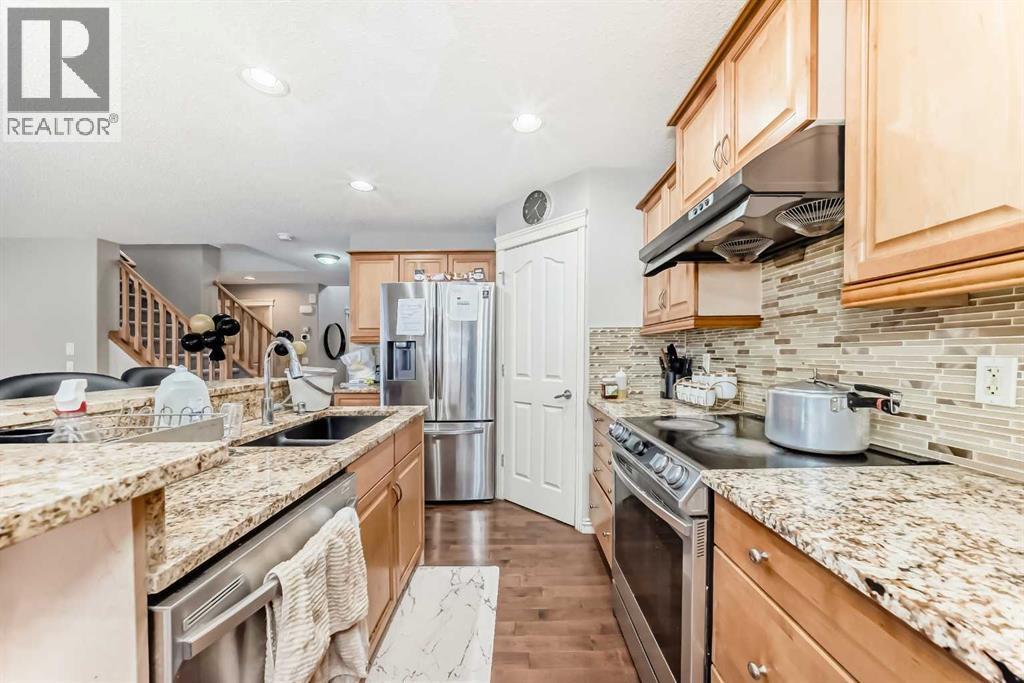 2468 Kingsland View Se, Airdrie, AB - Indoor Photo Showing Kitchen With Double Sink With Upgraded Kitchen