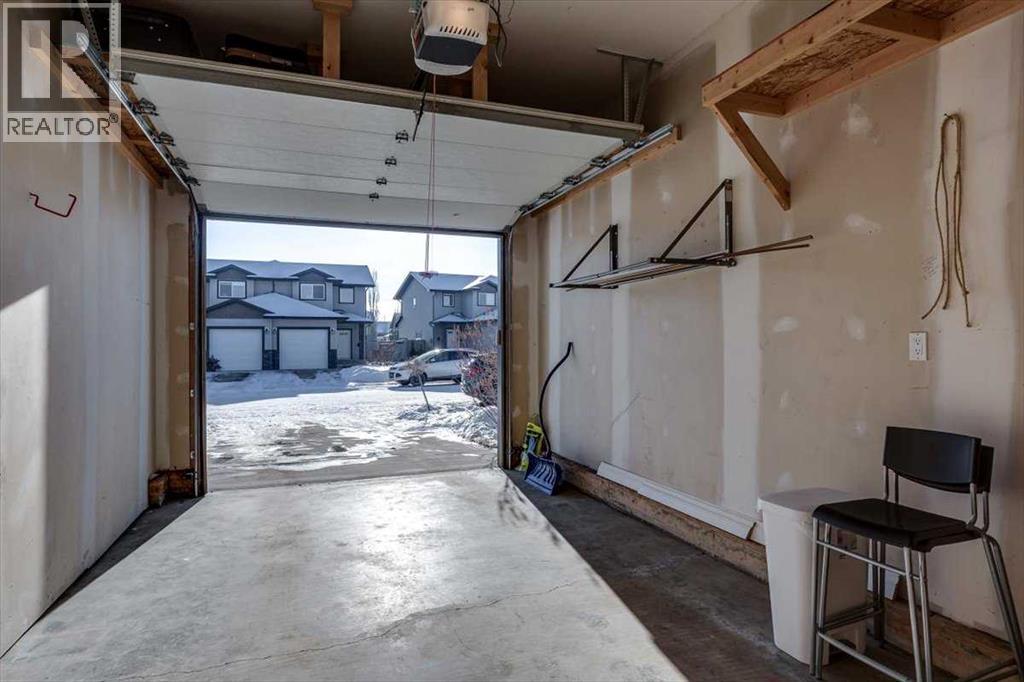 97 Piper Close, Blackfalds, AB - Indoor Photo Showing Garage