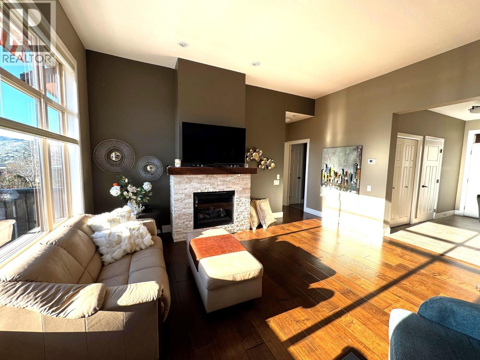 2167 Talavera Place, Westbank, BC - Indoor Photo Showing Living Room With Fireplace