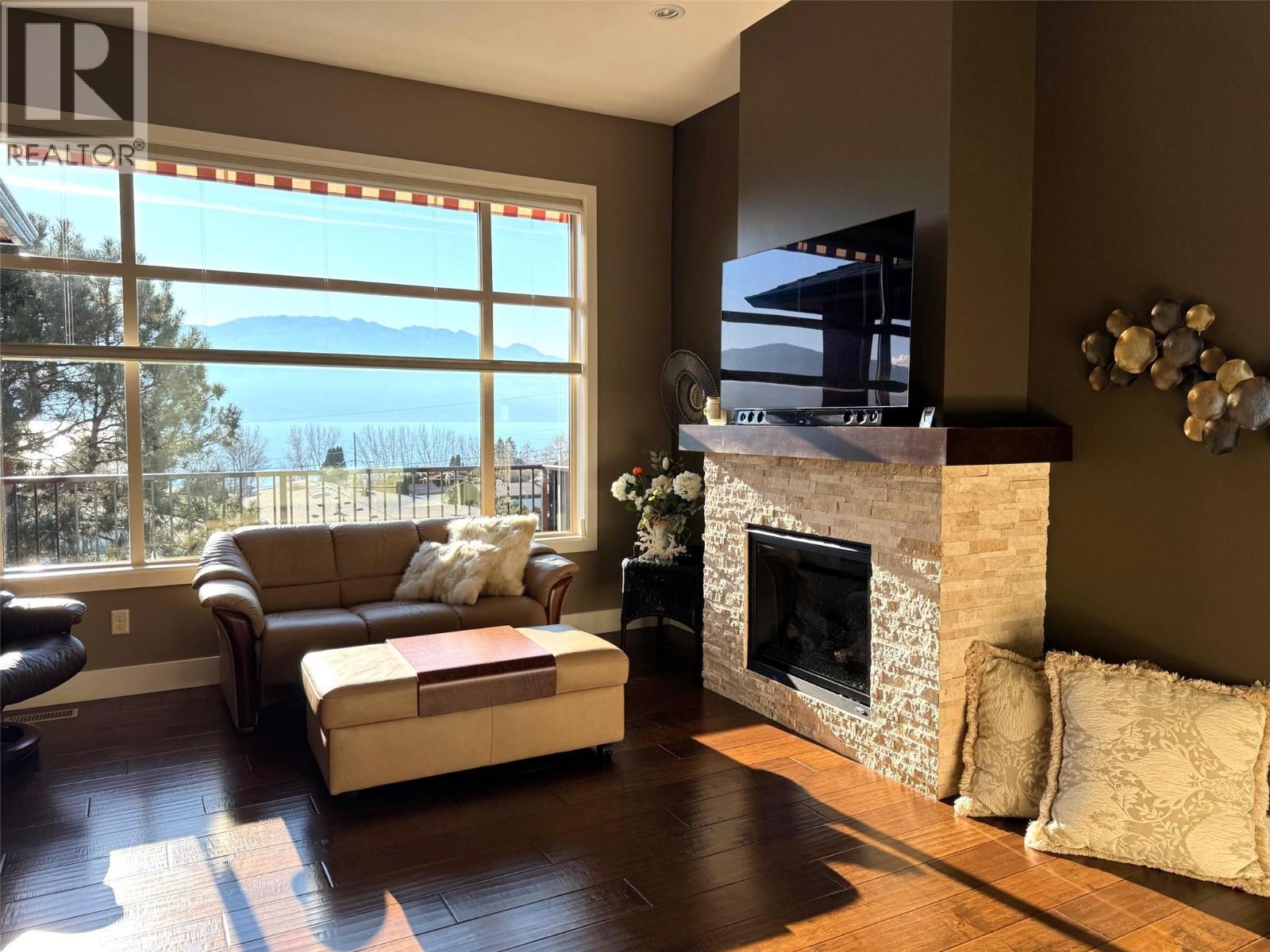 2167 Talavera Place, Westbank, BC - Indoor Photo Showing Living Room With Fireplace