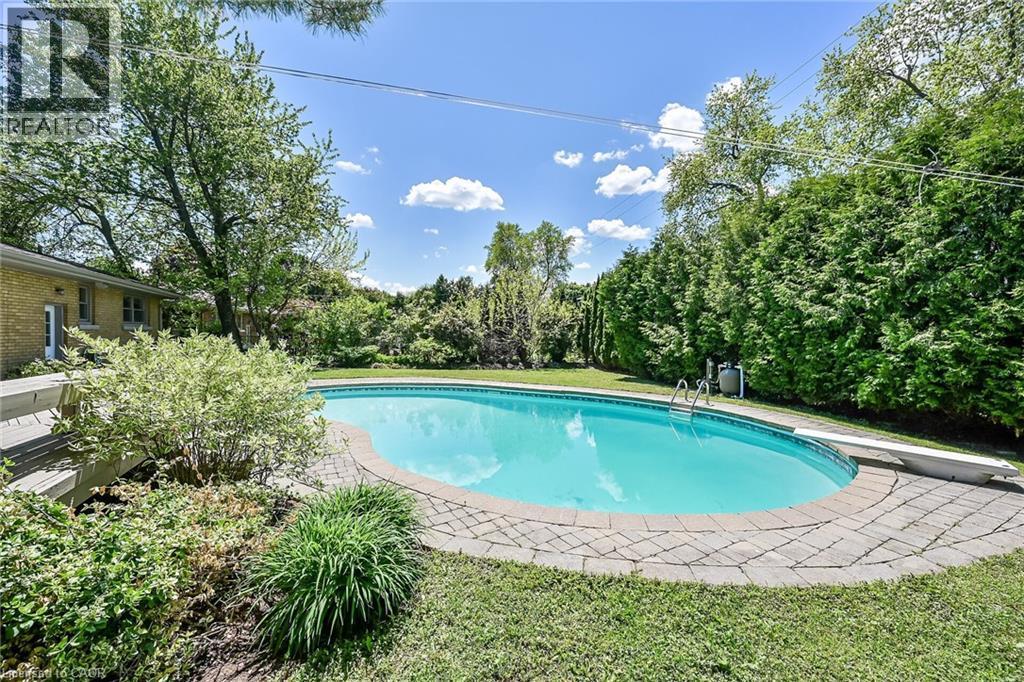128 Oneida Boulevard, Ancaster, ON - Outdoor With In Ground Pool With Backyard