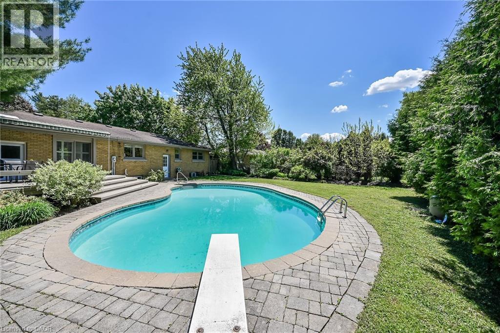 128 Oneida Boulevard, Ancaster, ON - Outdoor With In Ground Pool With Deck Patio Veranda With Backyard