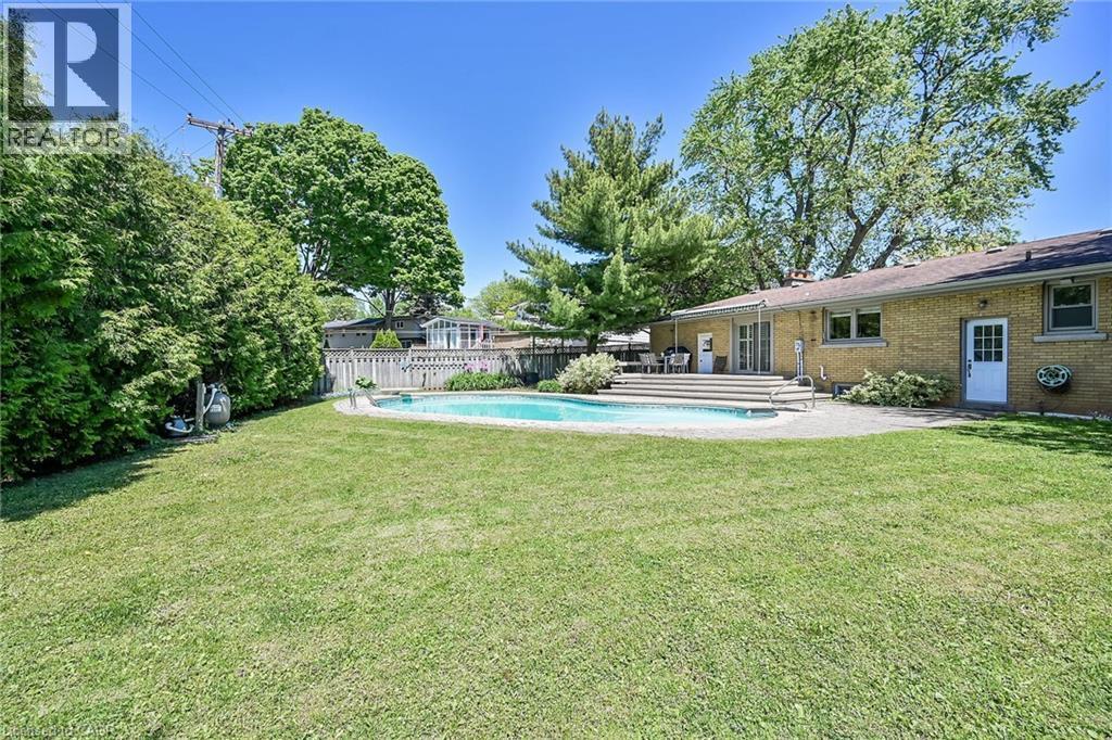 128 Oneida Boulevard, Ancaster, ON - Outdoor With In Ground Pool