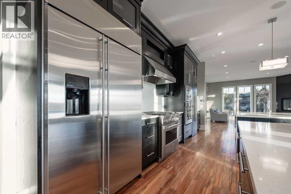 16 Spring Valley Way Sw, Calgary, AB - Indoor Photo Showing Kitchen With Stainless Steel Kitchen With Upgraded Kitchen