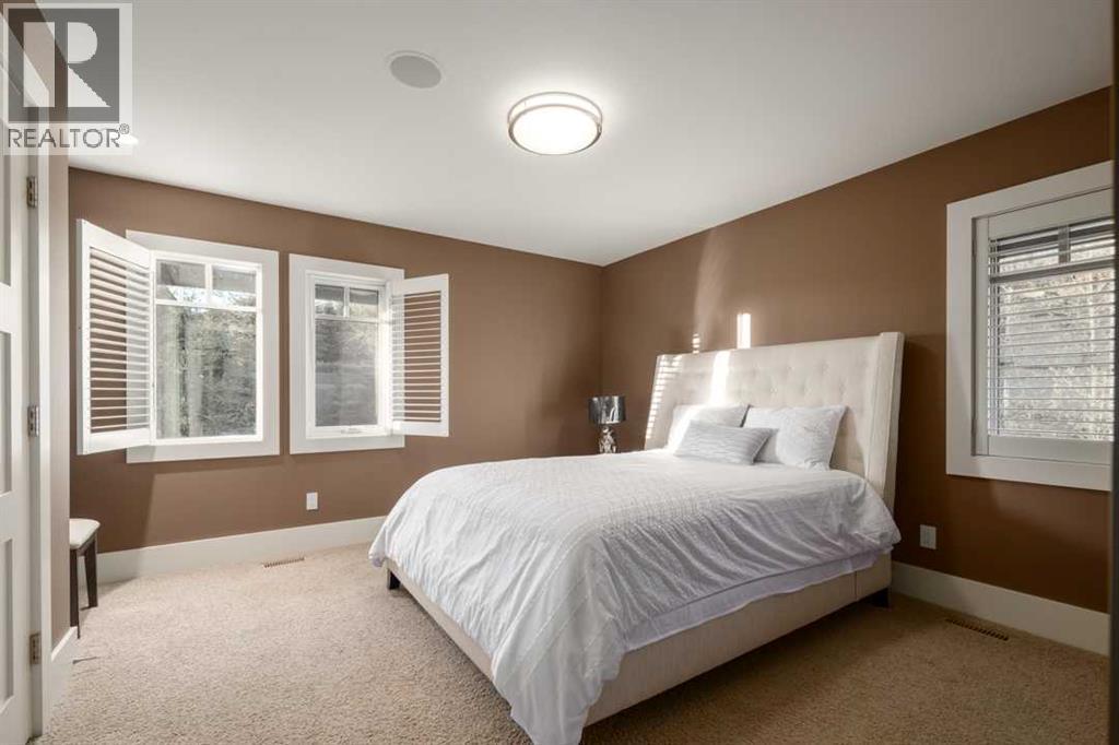 16 Spring Valley Way Sw, Calgary, AB - Indoor Photo Showing Bedroom