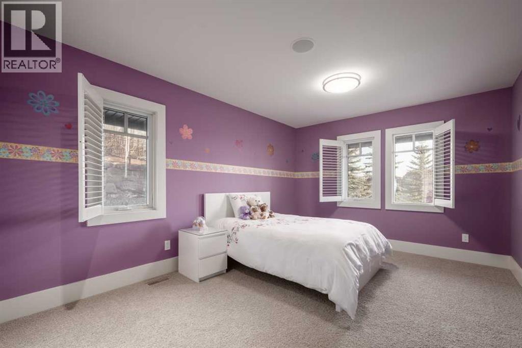 16 Spring Valley Way Sw, Calgary, AB - Indoor Photo Showing Bedroom