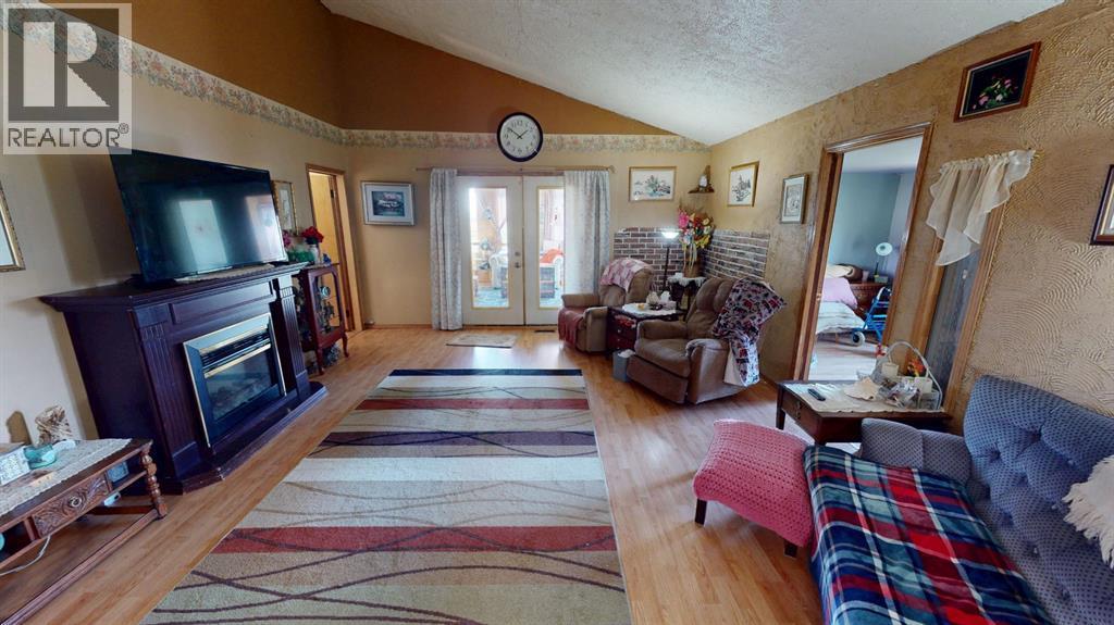 219 181043 Hwy 550 Drive, Rural Newell, County Of, AB - Indoor With Fireplace