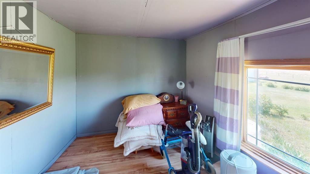 219 181043 Hwy 550 Drive, Rural Newell, County Of, AB - Indoor Photo Showing Bedroom